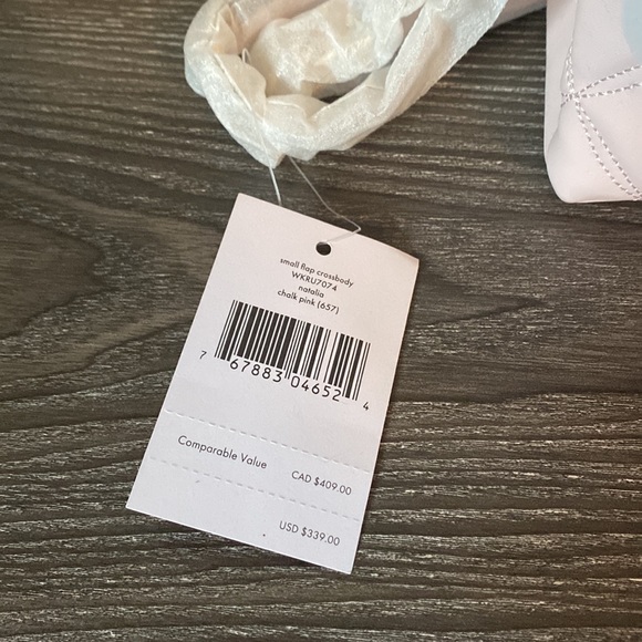 Small chalk pink Natalia cross body bag with tags attached and packaged. - Picture 2 of 6